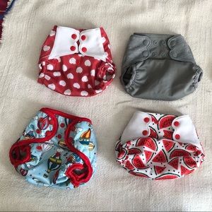 Bundle of five cloth diaper covers including Elf brand adjustable OS
